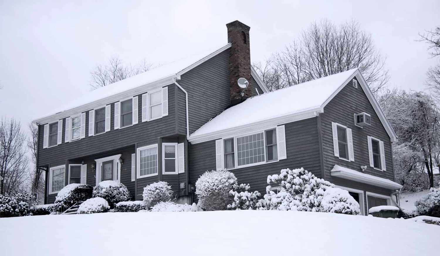 house with consistent snow on roof