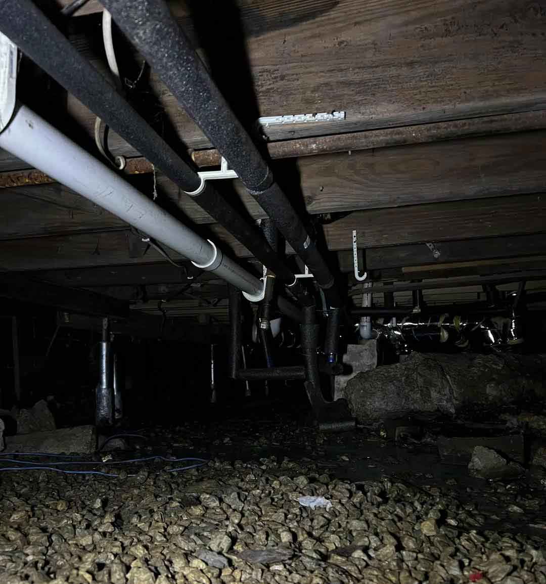 Notice that this home has no vapor barrier on the floor of the crawlspace to limit water and water vapor from entering.